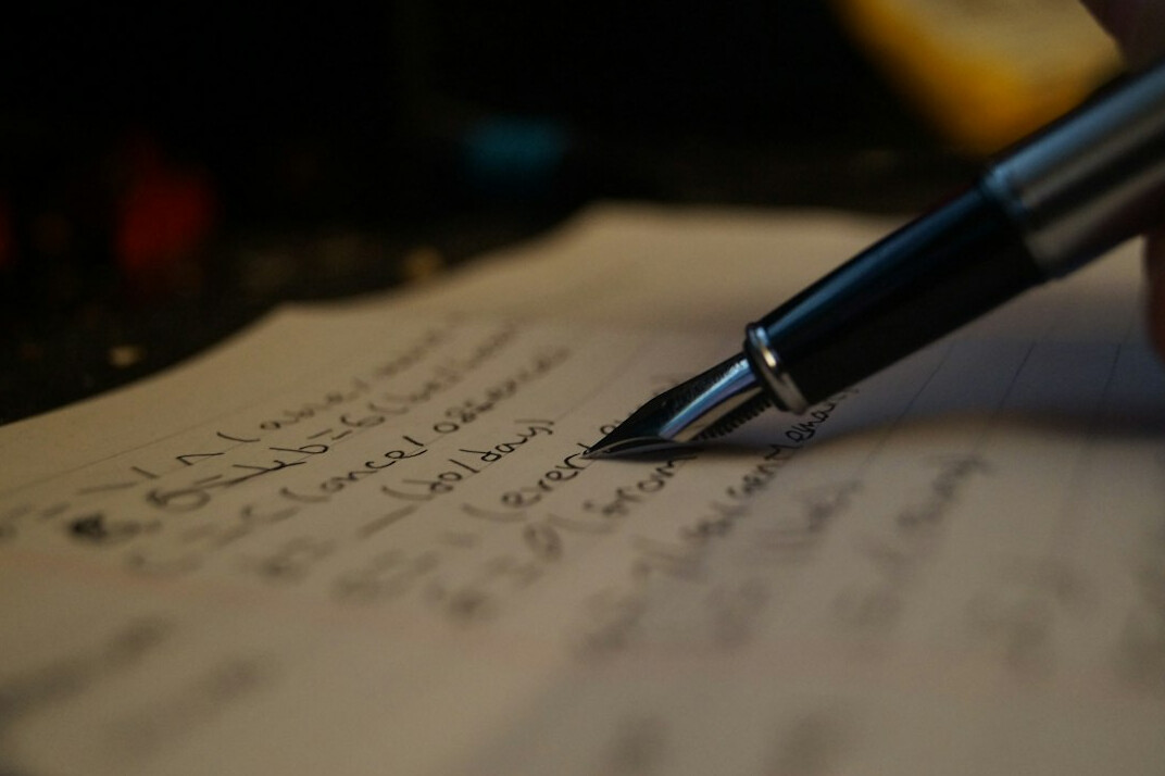 writer planning plot on paper